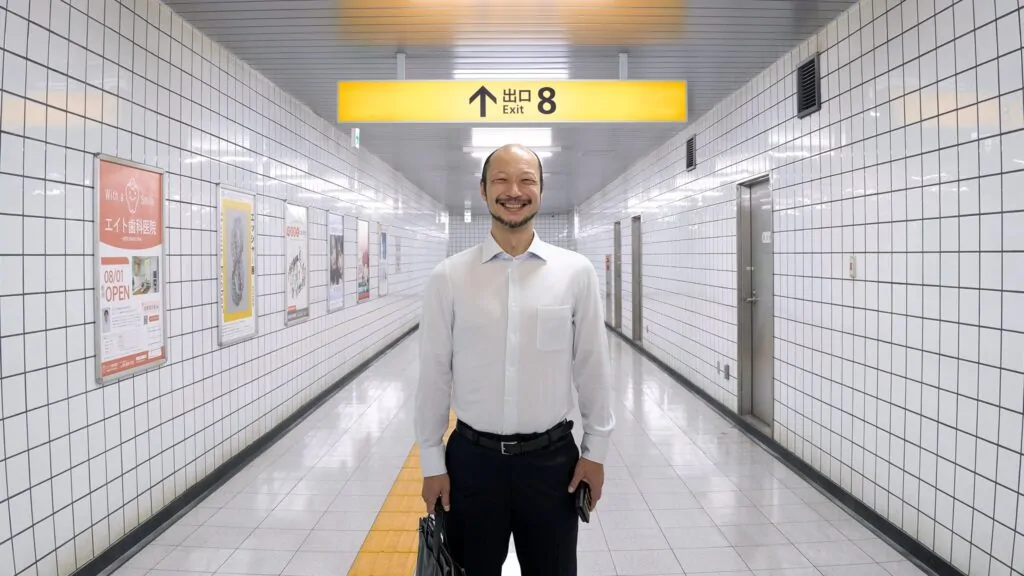 Yamato Kochi as The Walking Man in Genki Kawamura's EXIT 8, releasing in U.S. theaters this spring. (Credit: NEON)