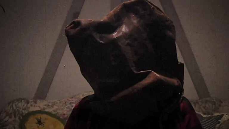 A woman tied to a chair in Man Finds Tape