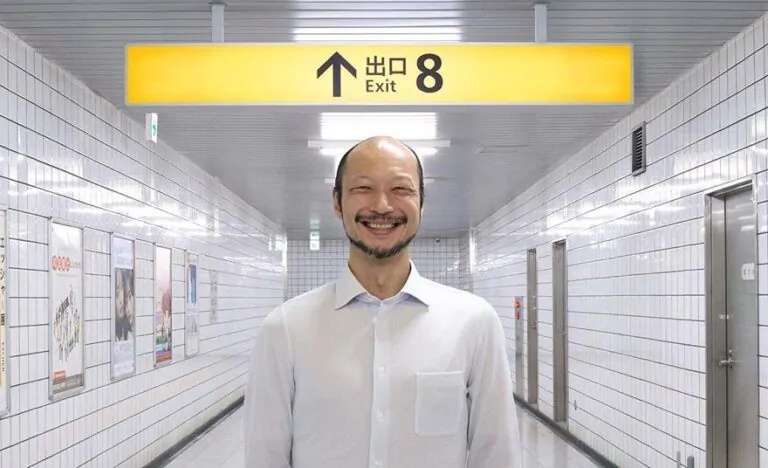 Yamato Kochi as The Walking Man in Genki Kawamura's EXIT 8, releasing in U.S. theaters on April 10 (Credit: NEON)