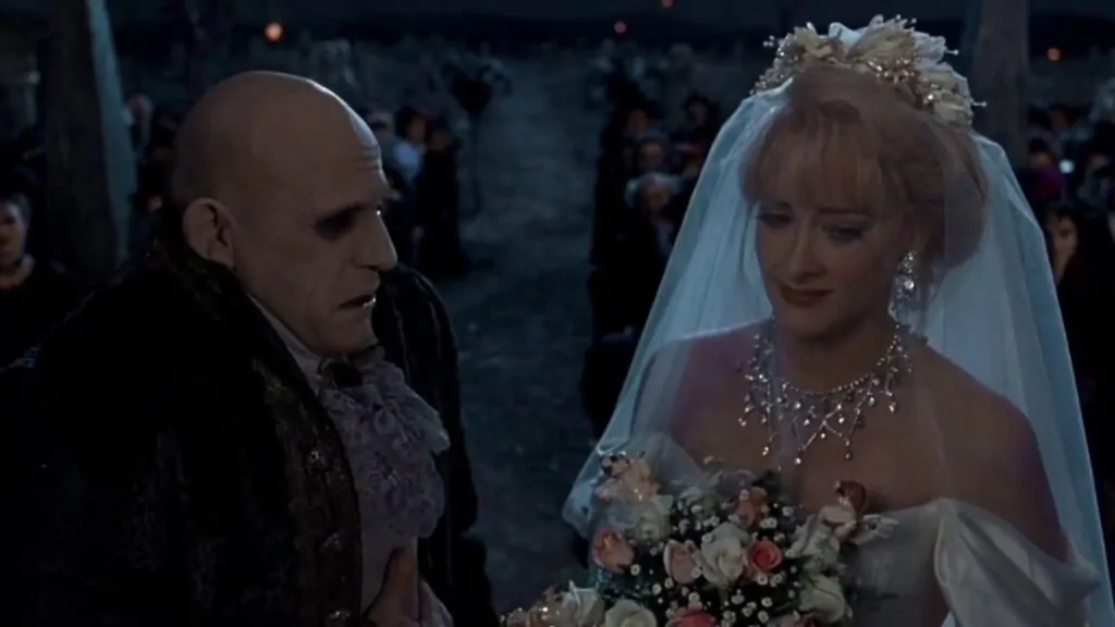 Uncle Fester and Debbie Jellinksy in ADDAMS FAMILY VALUES (Credit: Paramount Pictures)