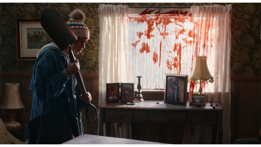 Canadian horror movies: Elyse (Morgan Holmstrom) returns home to an unexpected mess as tension mounts in ANCESTRAL BEASTS. Filmed in studio on Treaty 1 territory in Winnipeg, Manitoba. Photo by John Wapioke. Image courtesy of Michif Koonteur.