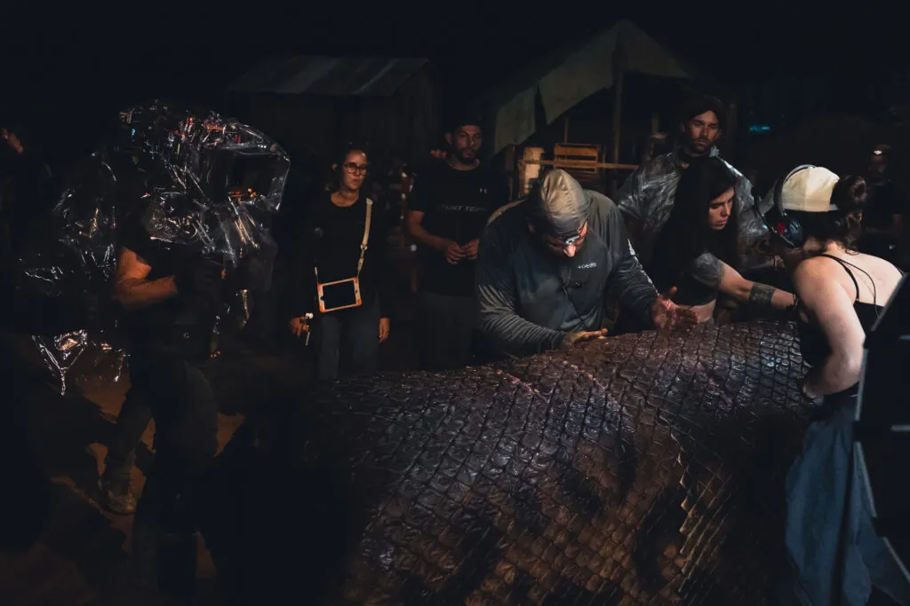 The crew with the titular snake in Beware Boiúna