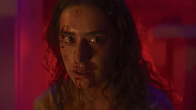 Paige Evans as Theo in GODMOTHER