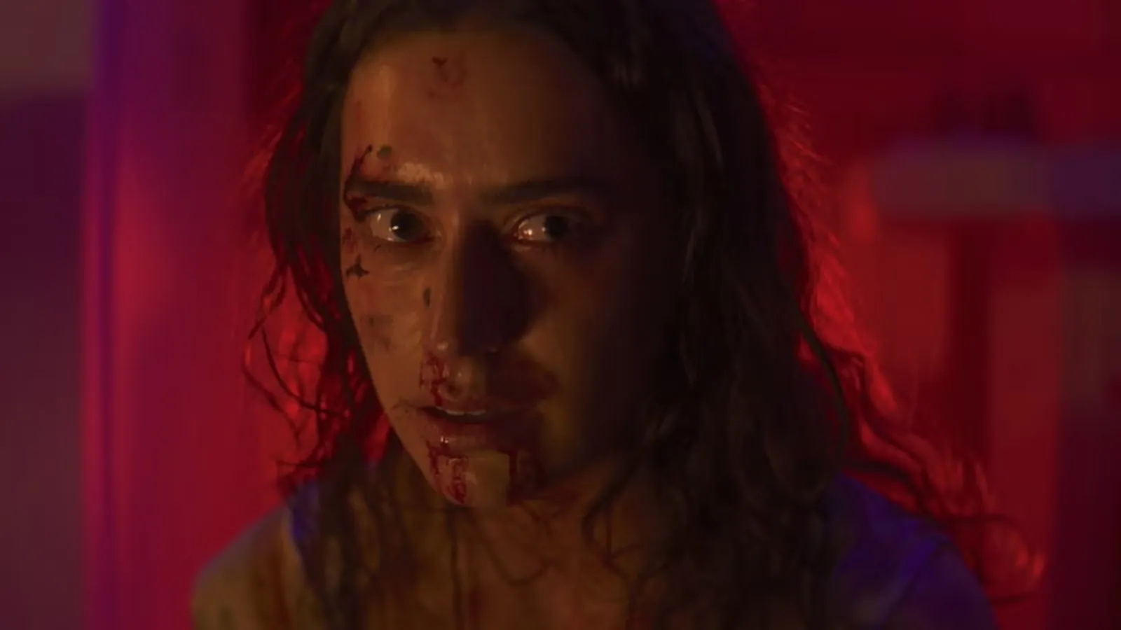 Paige Evans as Theo in GODMOTHER