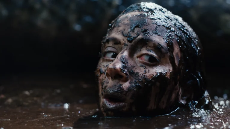 A woman trapped in the mud in Beware Boiúna
