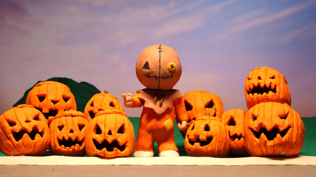 Sam and a group of jack-'o-lanterns in SAM'S HARVEST.